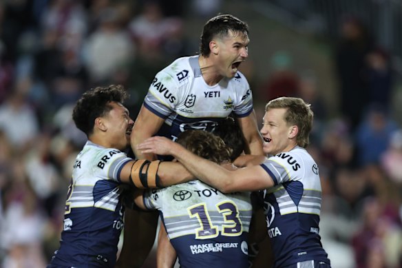 The Cowboys celebrate the match-winning field goal by Scott Drinkwater (obscured).
