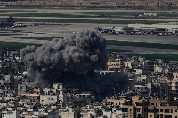 Smoke rises following an Israeli airstrike in Dahiyeh, Beirut's southern suburb, near Rafik Hariri International Airport, Lebanon, Wednesday, March 4, 2026. (AP Photo/Bilal Hussein)