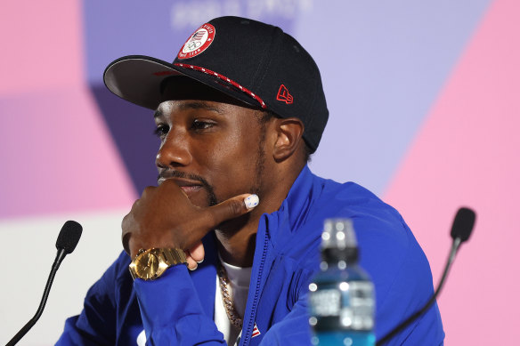 Lyles wears a cap with the words “Made It” stitched under the brim. 