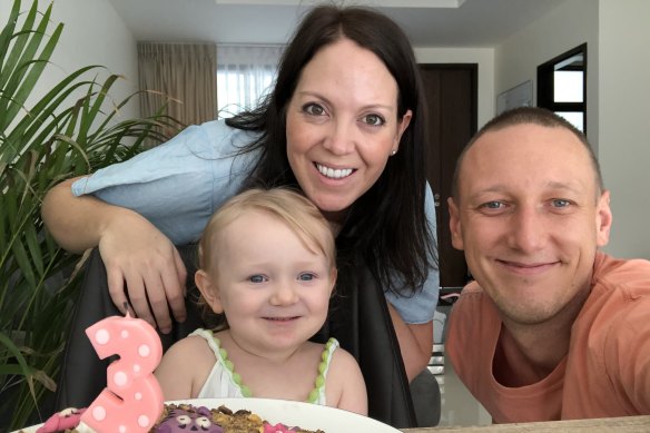 Australian Zack Dwyer and South African Kate Leff with their daughter are living in Thailand and must travel to Australia to activate Ms Leff's migrant partner visa.