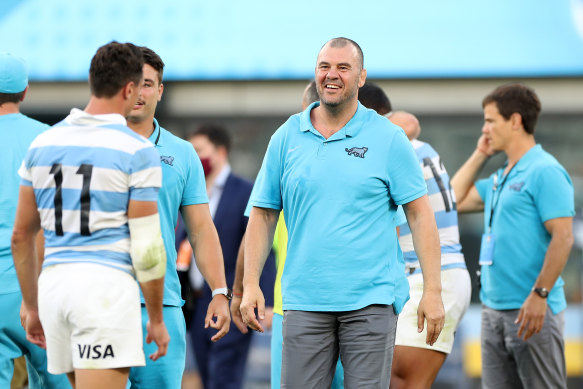 Former Wallabies coach Michael Cheika, who now works with Argentina, celebrates with the team.
