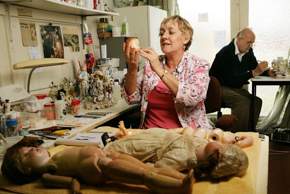 Anne Taylor and Charles Philipp at work on the dolls in 2005.