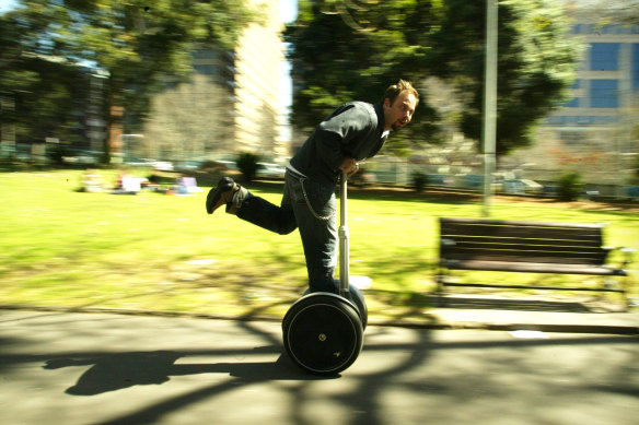 Kevin Adams rides one of the first Segways in Australia through Sydney's Belmore Park in 2003.

