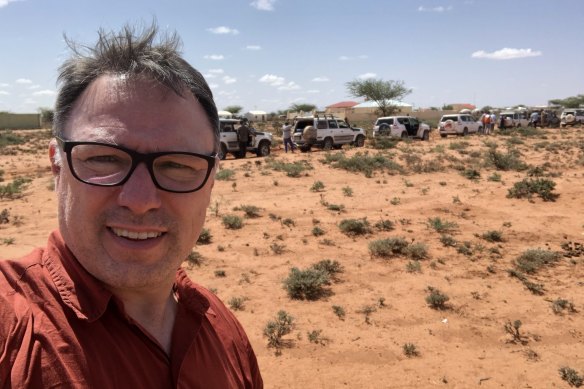 Matt Wade with the World Vision convoy and armed escort in Somaliland.