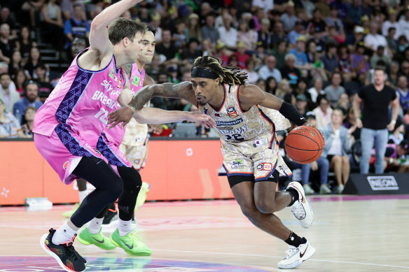 Taipans skipper Tahjere McCall, challenged here by the Breakers’ Tom Abercrombie, contributed 18 points to his team’s haul in their match at Spark Arena in Auckland on Sunday.