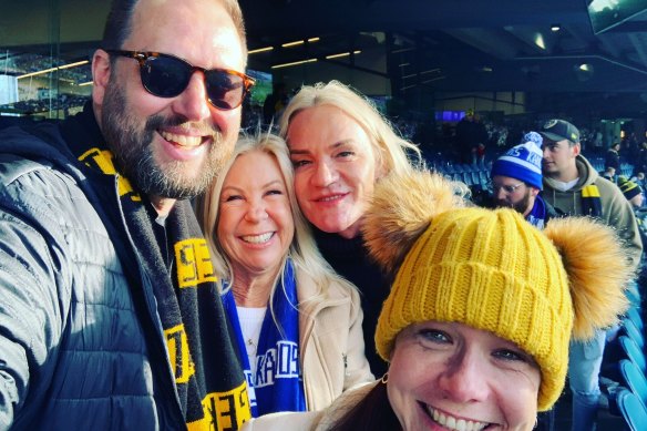This article’s author and Laidley biographer, with wife Nikki, Leckie and Laidley at a North Melbourne v Richmond match in August.