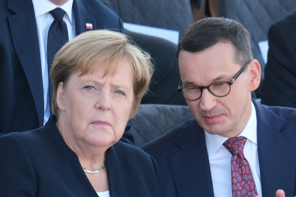 German Chancellor Angela Merkel and Polish Prime Minister Mateusz Morawiecki commemorate the 80th anniversary of the outbreak of World War II in Warsaw on Sunday.