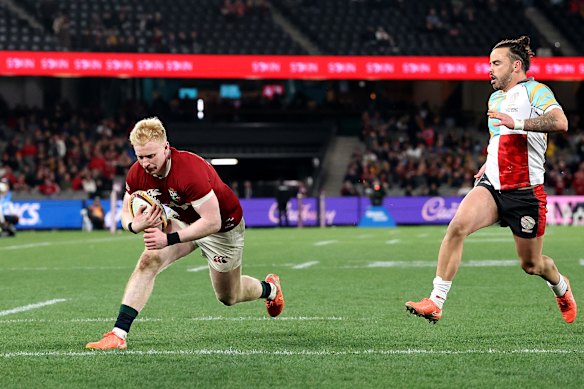 Jamie Osborne of the British & Irish Lions dives over for the third try.