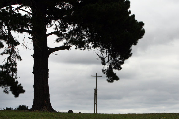 A cross stands on the site of the Lake Condah Mission’s church, destroyed in 1957. 
