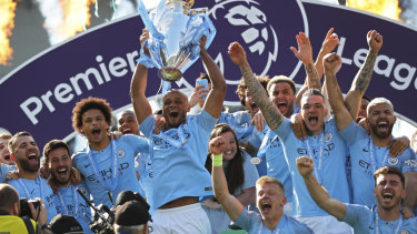 Too strong: Manchester City celebrate another title success.