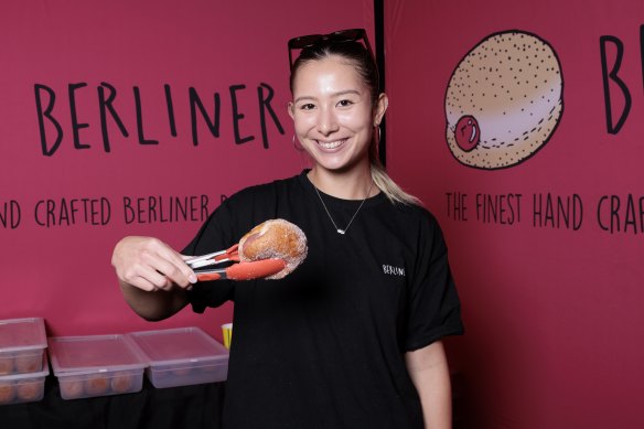 Angela Pidgeon with a rhubarb and custard-filled doughnut at Berliner Bakery.