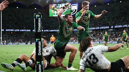 Kyle Feldt of Australia celebrates scoring a try in the men's final against New Zealand at Bankwest Stadium.