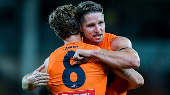 Callan Ward and Jesse Hogan celebrate the Giants’ win over Port Adelaide.