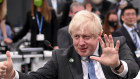 British PM Boris Johnson indicates 1.5 degrees with his hands at the summit this week.