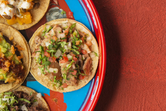 Carnitas tacos with pico de gallo. 