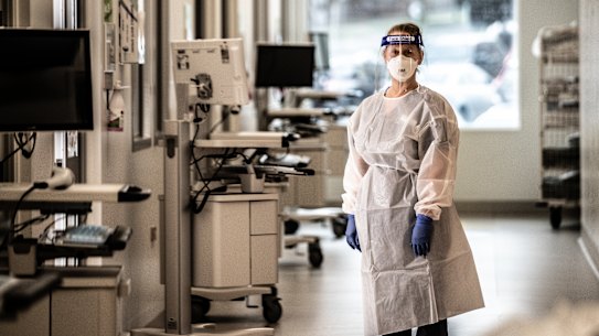 A paediatric nurse helps prepare extra ICU beds at the Monash Hospital in Melbourne  before an expected surge in COVID-19 patients.  