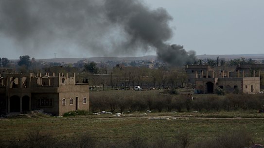 Smoke rises after a strike on Baghouz, Syria, the Islamic State group's last piece of territory.