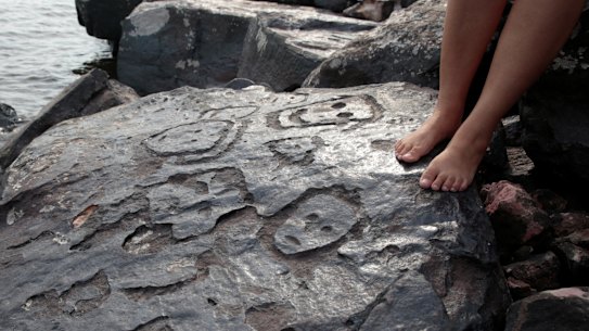 Ancient stone carvings on a rocky point of the Amazon River exposed after water levels dropped to record lows during a drought in Manaus, Brazil.
