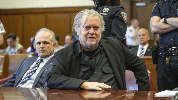 Steve Bannon, center, appears in Manhattan Supreme Court, Thursday, May 25, 2023 in New York. Bannon, the conservative strategist, will stand trial next May on charges he duped donors who gave money to build a wall on the U.S.-Mexico border, a judge in New York said Thursday. (AP Photo/Curtis Means via Pool)