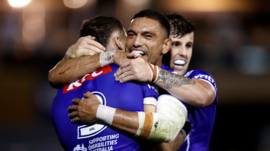 The Bulldogs celebrate Saturday’s win.