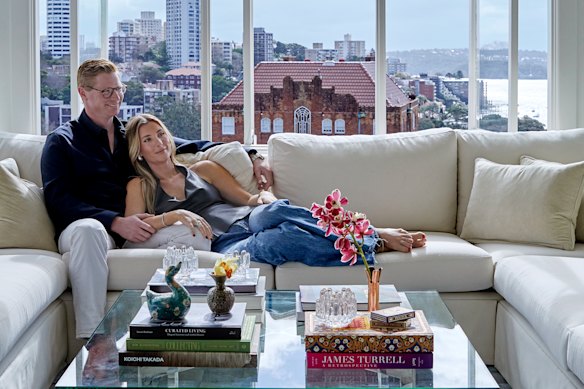 Owners Shona McElroy and Hamish Cooke on a bespoke lounge anchored by a Smac x Hali “Vicenza” rug designed by McElroy.