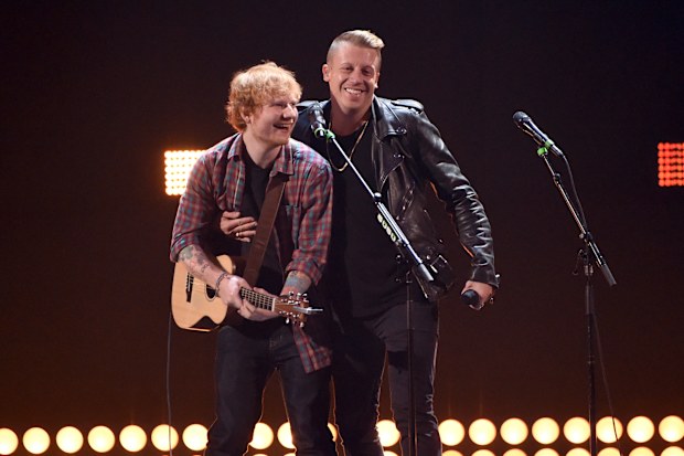 Singer/songwriter Ed Sheeran (L) and rapper Macklemore perform onstage during the 2014 iHeartRadio Music Festival at the MGM Grand Garden Arena on September 20, 2014 in Las Vegas, Nevada