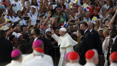 Pope Francis waves goodbye to crowds after a five-day visit in Panama City.