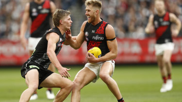 Collingwood rookie Jay Rantall takes on Essendon captain Dyson Heppell on Anzac Day.