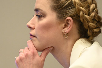 Amber Heard listens during the trial.