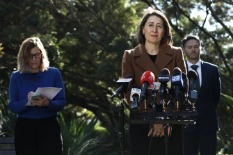 Premier Gladys Berejiklian, Minister for Customer Serivce Victor Dominello and NSW Chief Health Officer Dr Kerry Chant update the media on the NSW government's coronavirus response at NSW Parliament in Sydney on JThursday.