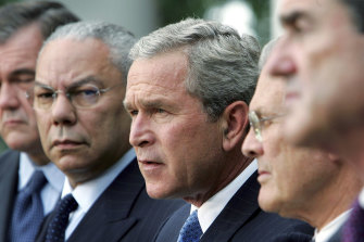 Powell, left, pictured with president George W Bush, centre, in 2004.