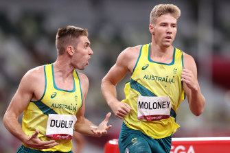 Ash Moloney gets encouragement from Cedric Dubler in the last event of the decathlon at the Tokyo Olympics.