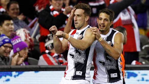 Big hit: St Kilda's Luke Dunstan (left) celebrates a goal against Carlton.