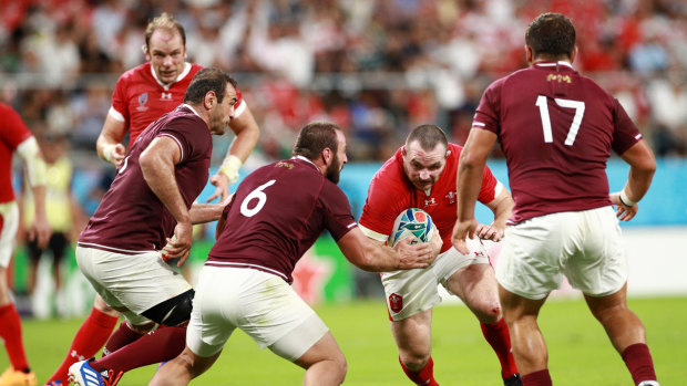 Georgia players defend their line against Wales.