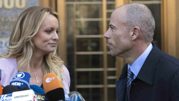 Stormy Daniels, left, stands with her lawyer Michael Avenatti outside court in April.