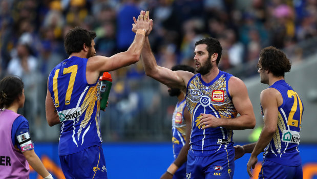 Strike force: Josh Kennedy congratulates Jack Darling (right) on booting another major for the Eagles.