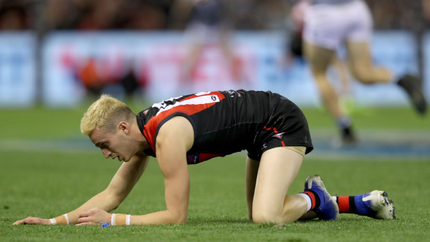 Orazio Fantasia of the Bombers after being hit off the ball by Power's Robbie Gray.