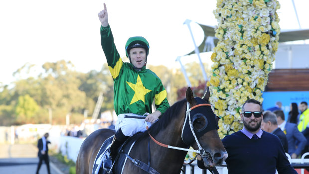 Tommy Berry  celebrates as Ole Kirk returns to to scale.