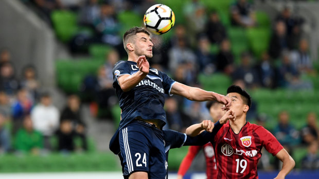 Aerial prowess: Terry Antonis heads clear for Victory during the Asian Champions League encounter against Shanghai SIPG at Melbourne Rectangular Stadium.