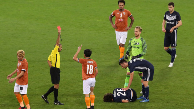 Thirayu Banhan of Chiangrai United is shown a red card.