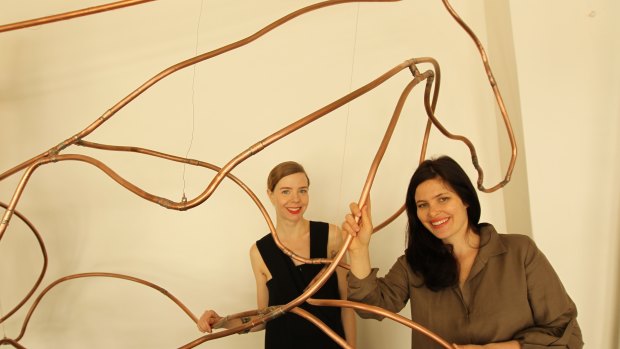 Bianca Spender (at left) and Highfield with her horse sculpture in Spender’s Paddington boutique.