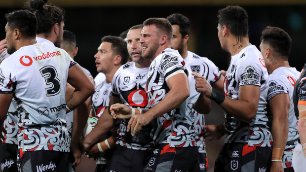The Warriors celebrate after Karl Lawton's try.