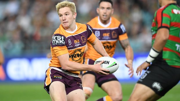  Teenage Brisbane halfback Tom Dearden looks to set up a support player.