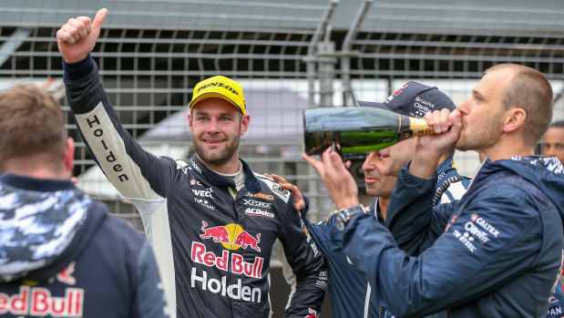 Toast: Shane van Gisbergen (second left) and his team celebrate victory in Auckland.