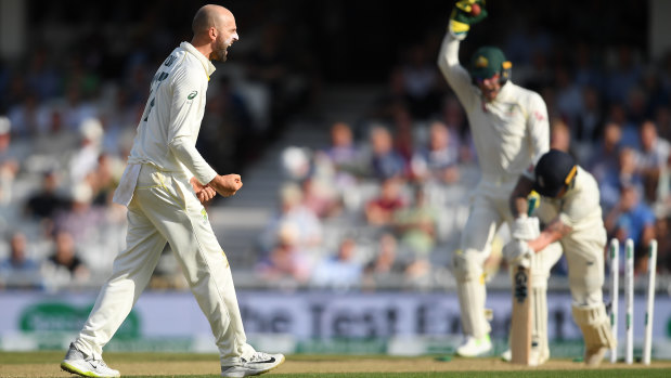 Nathan Lyon of Australia celebrates taking the wicket of Ben Stokes of England in a heated third day's action.