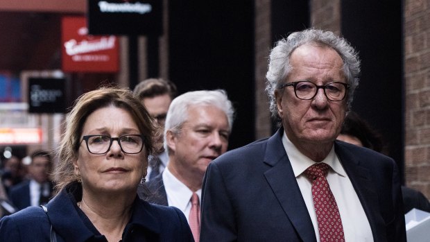 Geoffrey Rush and his wife Jane Menelaus leave the Federal Court in Sydney after his defamation win.