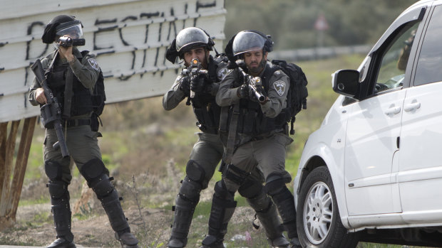Israeli security forces take position during clashes with Palestinians after a demonstration against the arrest of members of Fatah in Jerusalem by the Israeli authorities, at Hawara checkpoint near the West Bank city of Nablus, on Sunday.