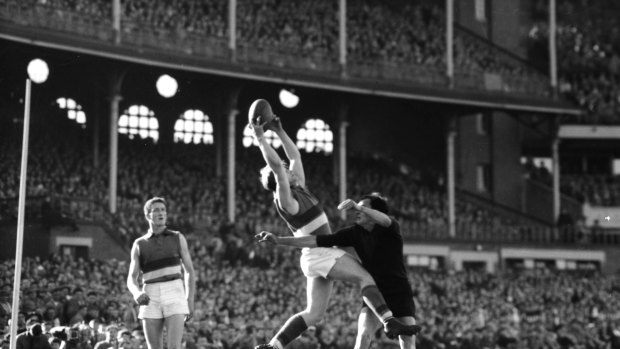 Footscray’s Jack Collins marks over Melbourne’s Lance Arnold.