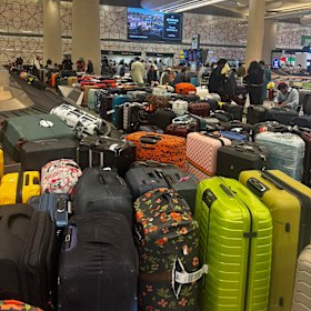 Bags filled the floor at the Abu Dhabi baggage carousel, as travellers desperately worked to find alternative arrangements.
