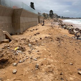 Exposed rocks from the seawall construction exposed on Collaroy Beach.